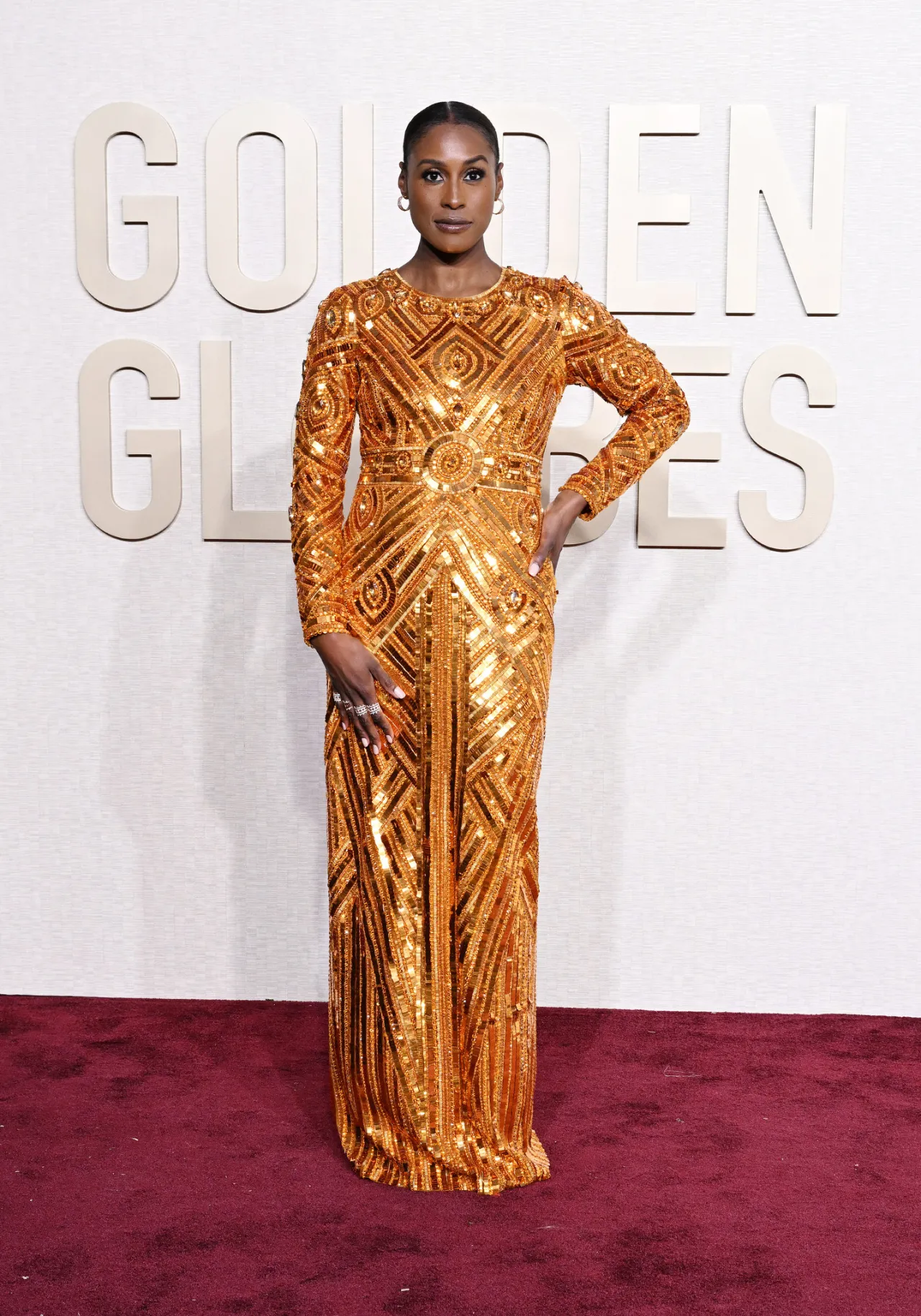 4.Issa Rae looked ethereal in a metallic orange of her geometric tile sequin-embroidered gown, from Pamella Roland’s Spring 2024 collection. She paired the look with diamond and gold jewelry by Qatar-based Noudar Jewels.