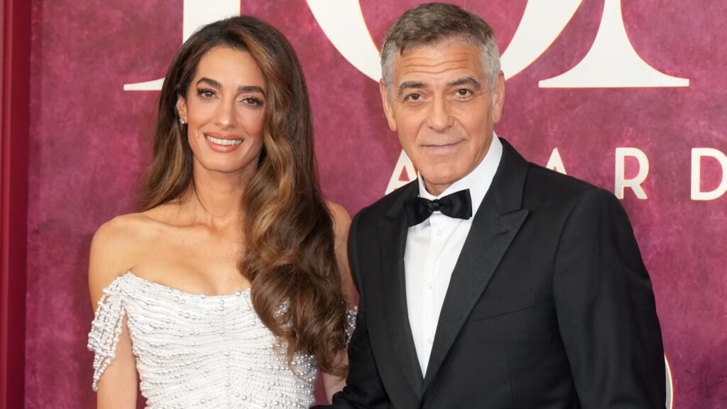 Amal and George Clooney attending an event in 2025