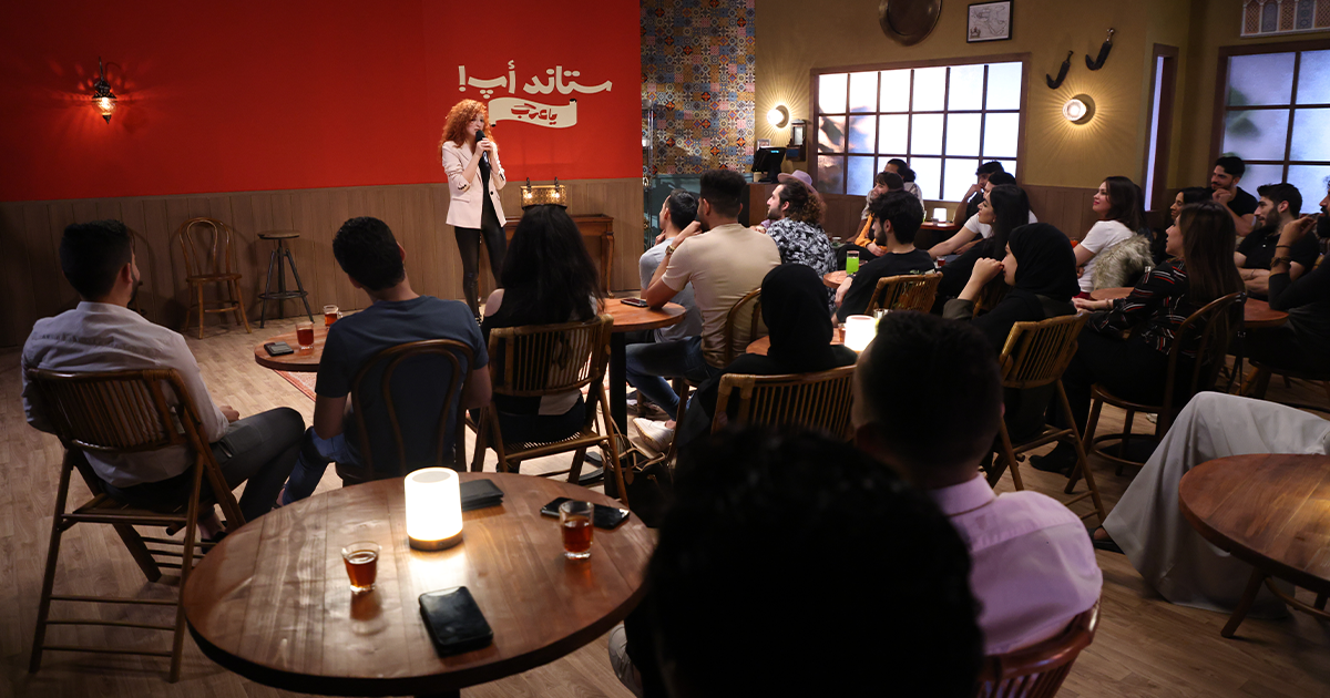 Comedians performing in the rising Middle East comedy scene on stage.