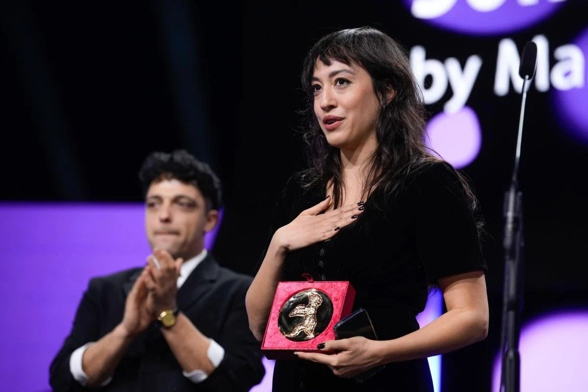 Marie-Rose Osta holding the Golden Bear for Best Short Film at Berlinale 2026
